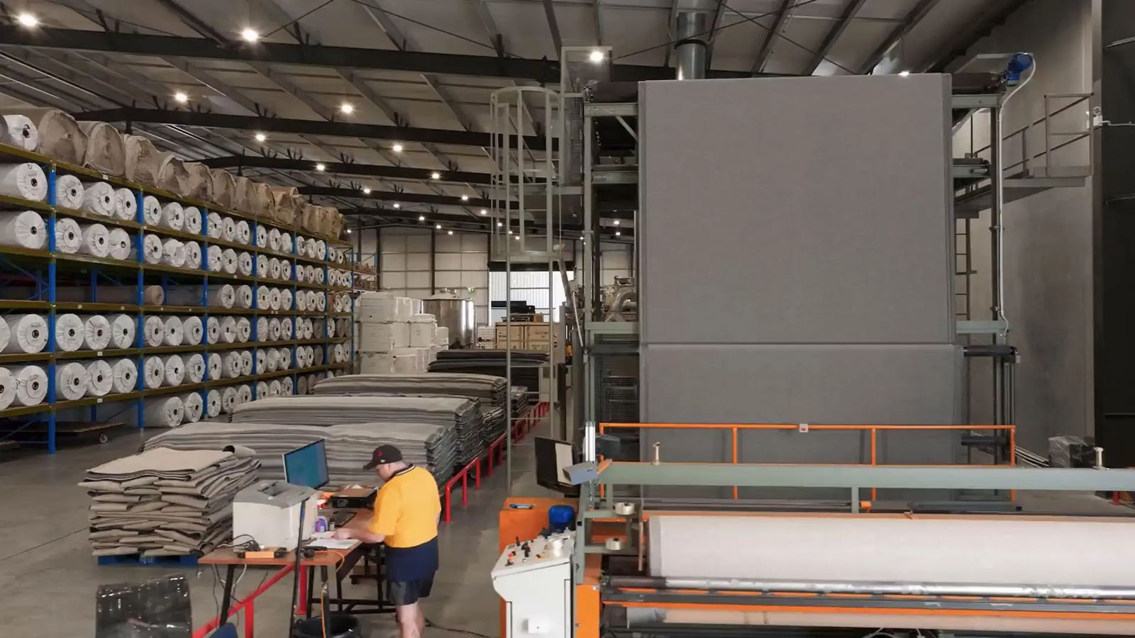 Material rolls racked in the production hall